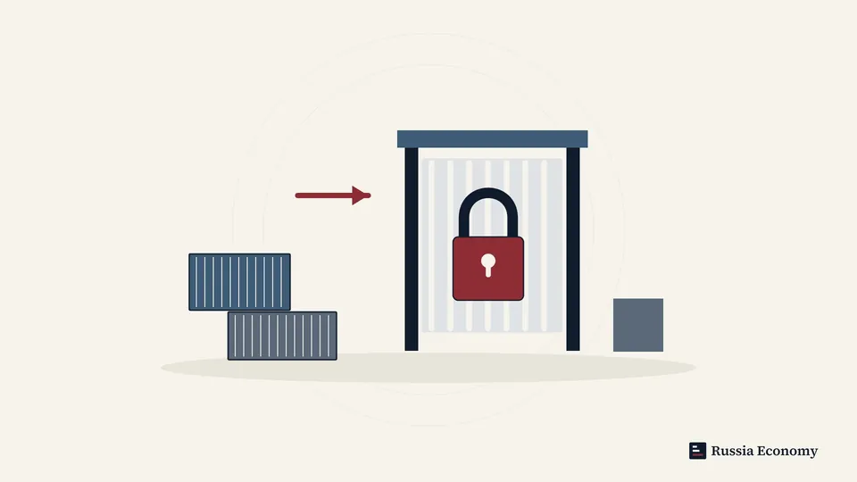 Cargo containers facing a closed checkpoint with a padlock.